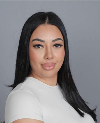 The image shows a small icon of a camera with a white background on the left side and a blurred photograph on the right, suggesting a feature related to photography or images within a web application or interface.